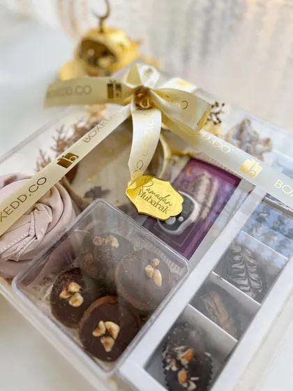 Another angle of the clear acrylic Ramadan hamper, showing the delicious-looking chocolate-covered dates.
