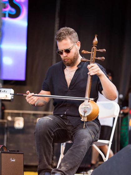 Michael Dwan Singh of The Shadow Notes playing the sarangi. I curate my events to include a mix of traditional instruments and modern electronic sounds, creating a unique diasporic soundscape.