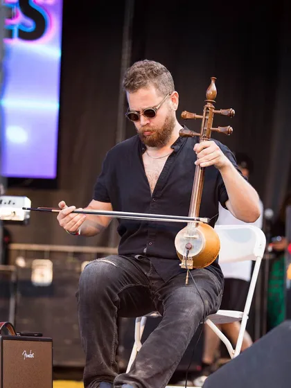 Michael Dwan Singh of The Shadow Notes playing the sarangi. I curate my events to include a mix of traditional instruments and modern electronic sounds, creating a unique diasporic soundscape.