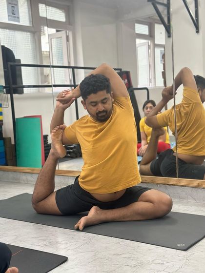 Our instructor, Ajinkya, demonstrates the Mermaid Pose, showcasing the alignment and technique we teach in our classes.
