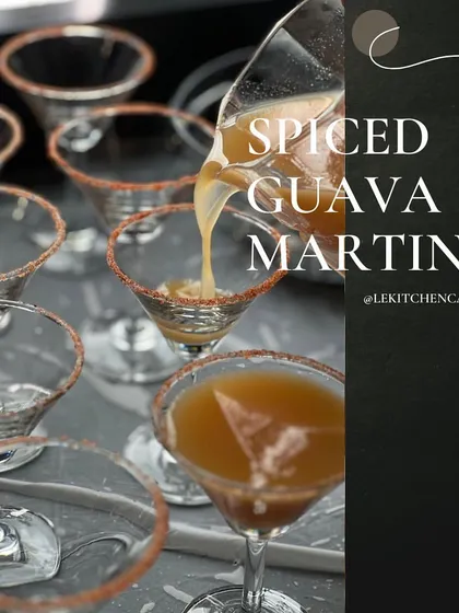 Our Spiced Guava Martini being poured into pre-rimmed glasses, a perfect example of our efficient and stylish bar service.