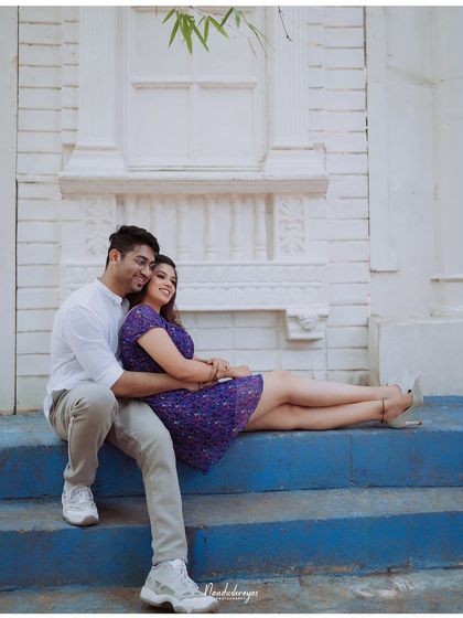 A relaxed and loving pose on the blue steps of our Santorini-inspired set.