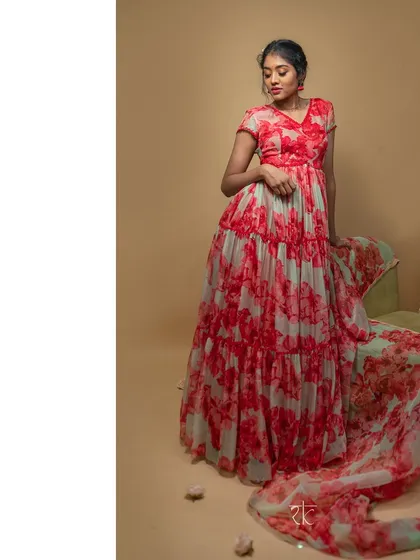 A full-length view of the red and mint floral organza gown, showing its cascading layers and the matching scalloped dupatta. A true masterpiece of grace.