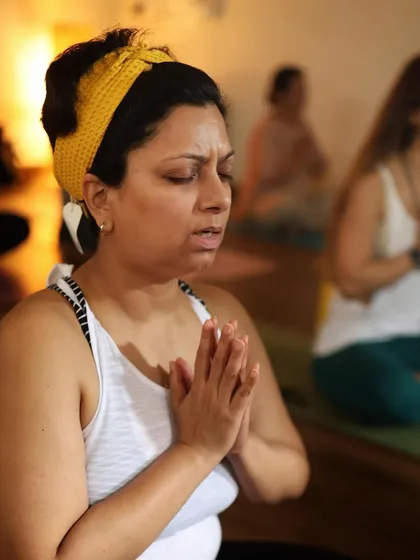 A student in a moment of focused intention at the start of class. The will to improve begins in the mind, and our community supports that inner resolve.