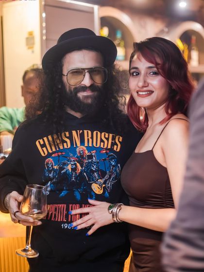 A couple enjoying a drink and the music. My events are couple-friendly.