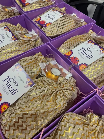 A closer look at a customized corporate order. We included personalized "Happy Diwali" cards from the client, Newgen, along with our handcrafted treats and festive diyas. These small, thoughtful details make each corporate hamper feel special.