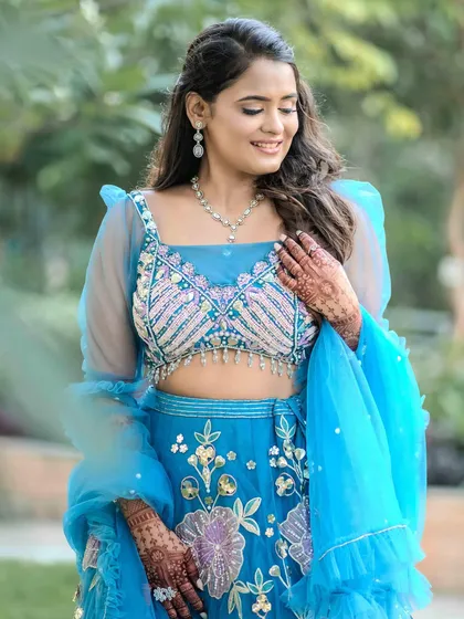 A close-up of Jinal's engagement look. The makeup is soft and pretty, with a focus on her radiant smile.