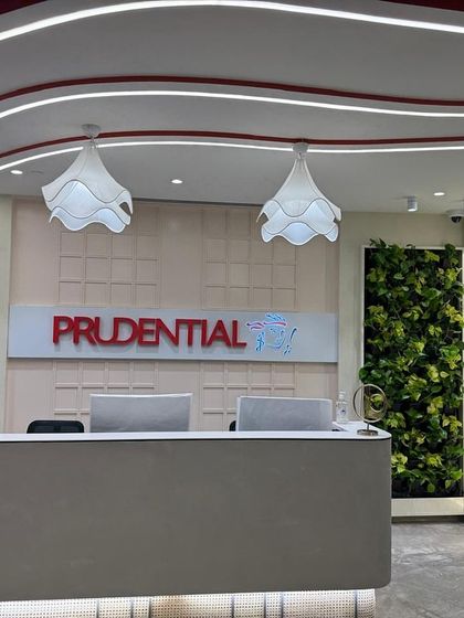 The completed reception area for Prudential at The Executive Centre. The twin vertical gardens create a powerful, symmetrical welcome, immediately establishing a biophilic and luxurious tone for the entire workspace.