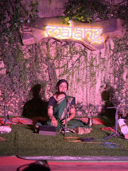 A full view of the 'Malang' stage at Namma Ashram. This shows how traditional music can be presented in contemporary, aesthetically pleasing spaces.