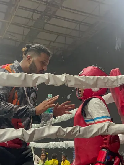 In the heat of competition, guidance is everything. I am in my fighter's corner during the IFMA National Championships, making sure they are focused, hydrated, and ready for the next round.