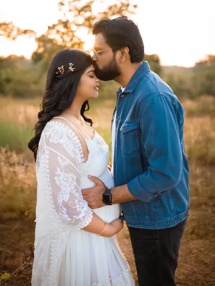 Capturing the quiet, intimate moments between partners is one of my favorite things. This golden hour pregnancy photo shows a tender kiss, highlighting the love and connection that started it all.