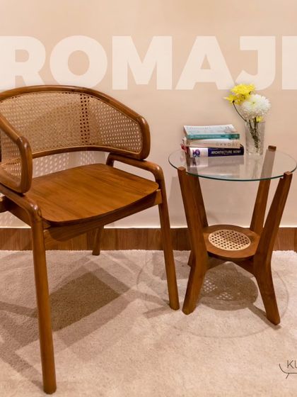 The 'Romaji' chair paired with my three-legged 'Tipoy' table. This combination showcases how my handcrafted teak furniture can create a beautiful and functional vignette in any space.