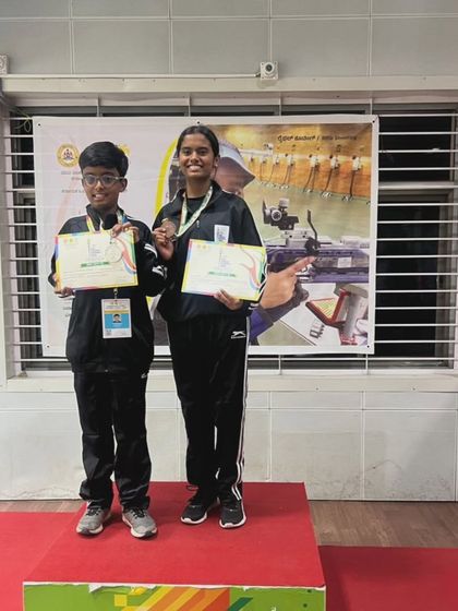 Our young champions from the 3rd Mini Olympics. Divyansh and Hitha proudly stand on the podium with their certificates and medals, representing the future of shooting sports.
