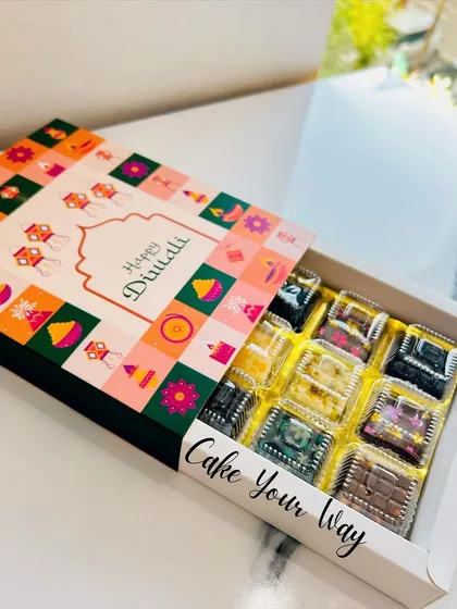 A closer look at the Festive Choco Bliss box. The vibrant packaging is designed to bring a smile, and the assorted chocolates inside are a gourmet treat for the festive season.