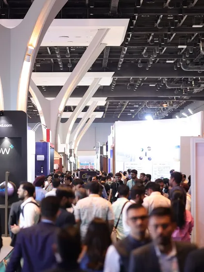 A view down a packed aisle of the Jio World Convention Centre, capturing the immense scale and high footfall that exhibitors can expect at our event.