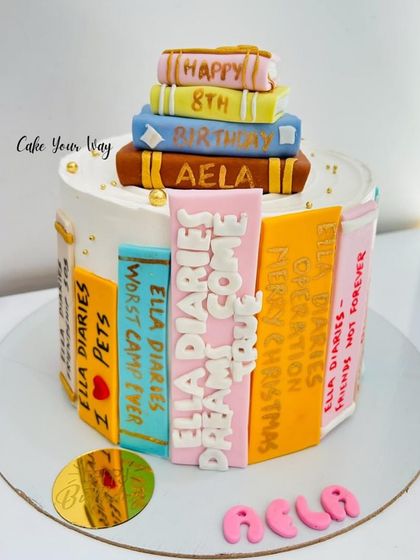 For the love of books and cake. This cake is designed as a stack of "Ella Diaries" books for an 8th birthday.