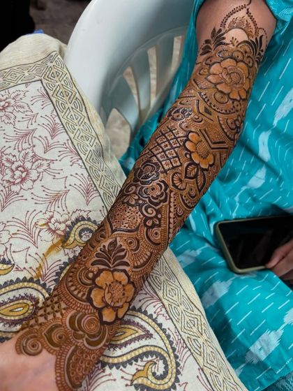 A seated view of the floral design, showing how it looks as part of the overall bridal attire.