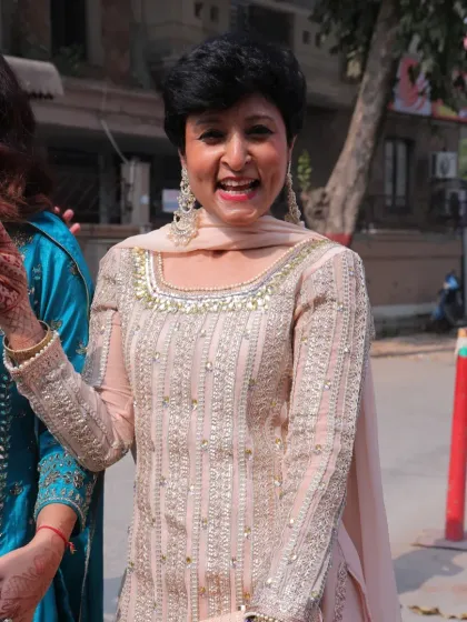A candid moment of joy at a family function. My goal is to help women feel this happy and vibrant in their own skin.