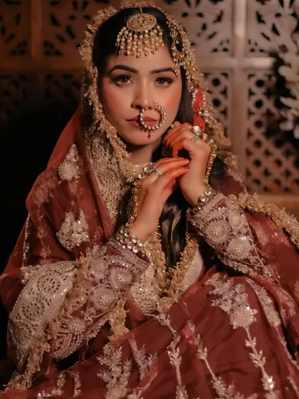 A Heeramandi-inspired portrait with a vintage feel, focusing on the model's expressive eyes and traditional jewelry.