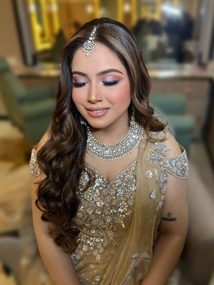 A close-up of this engagement bride's makeup. The eyes are the focus, with a beautiful blend of shimmery pinks and a defined lash line.