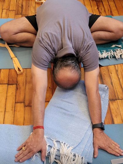 A forward bend in Baddha Konasana.