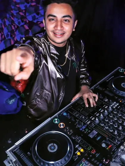Pointing to the crowd, inviting them to join the party. My style is all about interaction and making a personal connection.