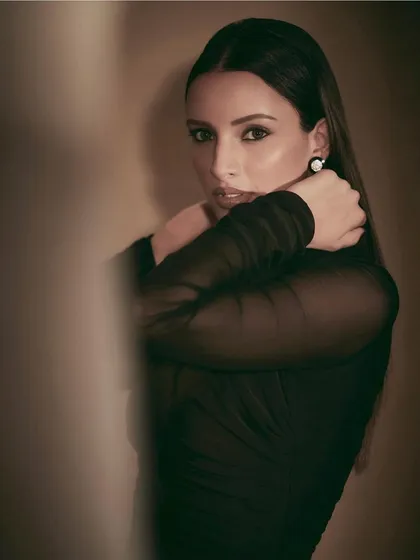 An all-black look is always a classic. I styled Tripti Dimri in this elegant ruched black dress with sheer sleeves, creating a sophisticated and versatile look suitable for many occasions.