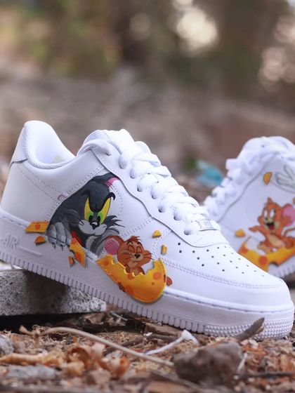 A dose of pure nostalgia with these Tom & Jerry custom Nike Air Force 1s. I designed the swoosh to look like a piece of cheese that Jerry is running on, while Tom is in hot pursuit. It’s a playful design that brings back childhood memories.