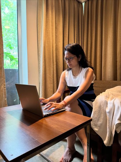 A photo of me working on my laptop. A book will go places your business card never can, building instant trust and setting you apart from the crowd.