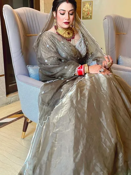 Another angle of the beautiful bride in her grey lehenga, showing the details of her makeup and jewelry.