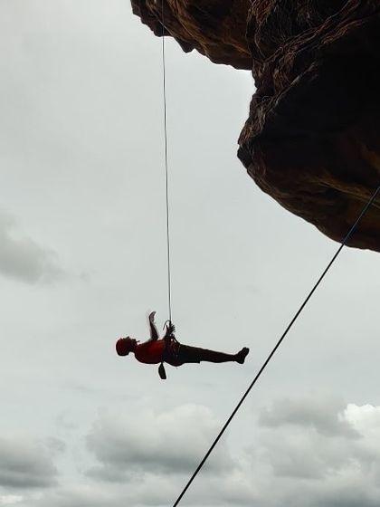 A dramatic shot of Rahul hanging from an overhang. His journey from a beginner to a confident lead climber is inspiring.