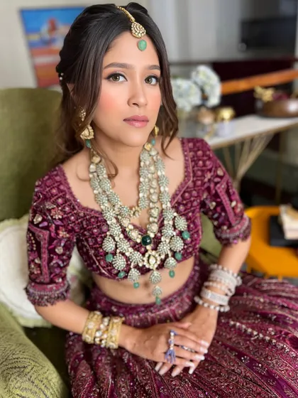 All glammed up. A beautiful party look for Anushka, featuring a rich velvet lehenga and sparkling jewelry.