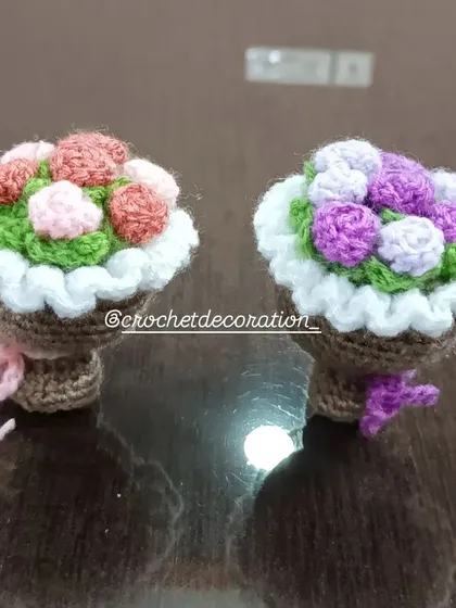 Two mini bouquet baskets, one with pink and red roses and the other with purple roses. These are a lovely alternative to traditional pots.