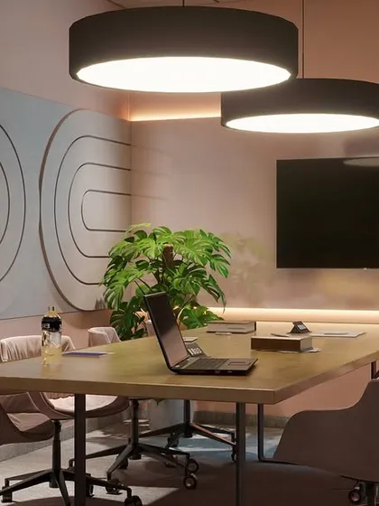 A similar meeting room concept, this time in a soft pink hue. The consistent design language across the rooms, differentiated by color, brings a sense of playful cohesion to the floor.