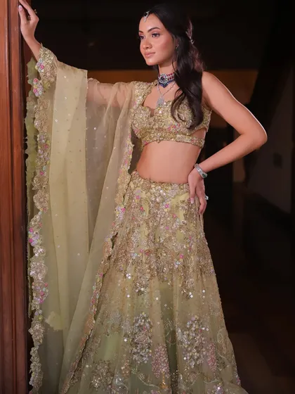 A beautiful pastel green lehenga styled for a daytime event. I paired it with a unique multi-colored necklace for a fresh and modern look.