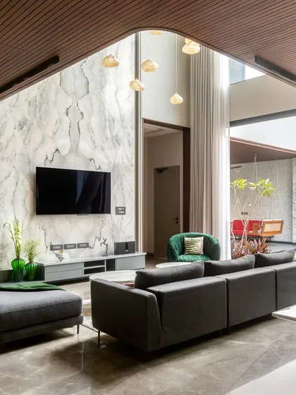 The family room of the APP Residence, which opens up to the courtyard. The design creates a seamless indoor-outdoor flow, perfect for family life and entertaining.