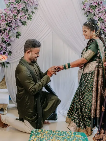 The groom gets down on one knee to propose during the ring ceremony, a romantic gesture that we love to capture.