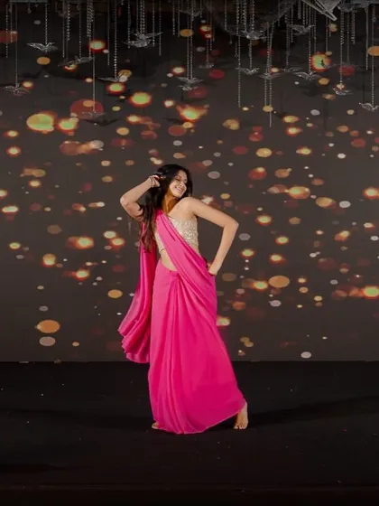 A solo moment on stage during a sangeet performance. Whether it's a group act or a solo, I ensure the lighting, stage presence, and choreography come together perfectly.