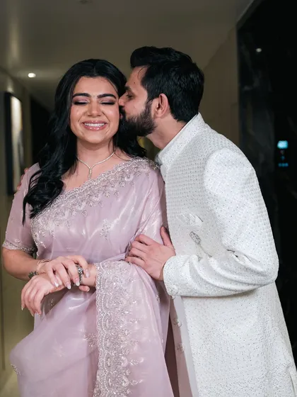 A gentle kiss on the cheek, a moment of pure affection and happiness. These are the quiet, candid shots that speak volumes.