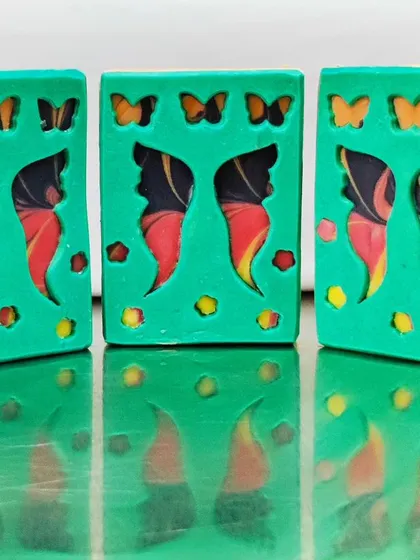 My "Butterfly Garden" entry, where I used a mantra swirl for the soap peeking through the wings. This technique created the perfect fiery colors.