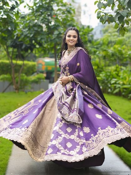 A twirl of happiness. This shot captures the beautiful movement of her lehenga and the joy of her special day.