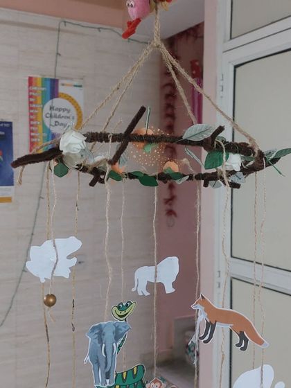 An animal-themed mobile made from natural twigs and paper cutouts. This was a lovely project combining nature, craft, and learning about animals.