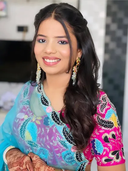 A portrait of the client with her boho-chic hairstyle.