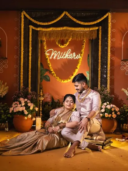 We designed this naming ceremony for little Mitharv to feel like a traditional South Indian village. The stage features a terracotta-hued backdrop, an antique-style door, and elements like brass lamps and marigold garlands to evoke a sense of timeless heritage.
