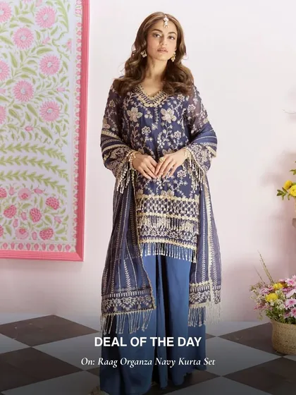 The Raag Organza Navy Kurta Set is a sophisticated choice for an evening event. The fringe details on the dupatta add a fun, modern touch.