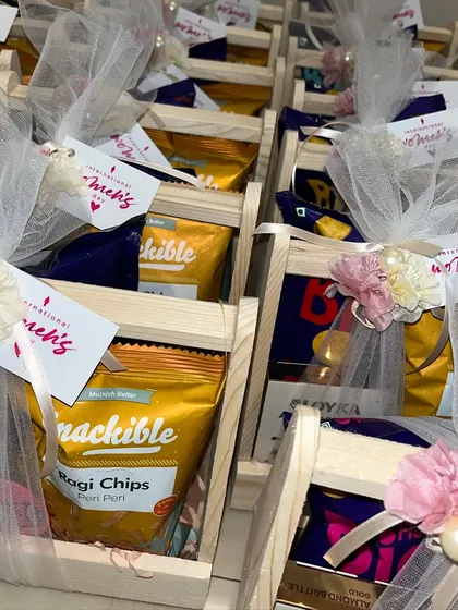 An array of the wooden baskets for the Angular Minds Women's Day event, showcasing our ability to create beautiful, consistent gifts in bulk.