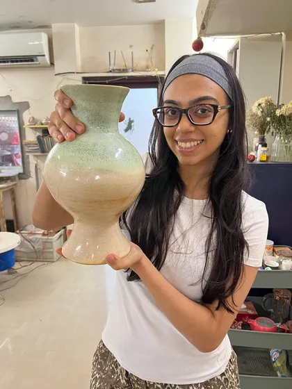 This is Hithika, one of our wonderful teachers, proudly holding a vase she threw on the wheel. Seeing students find their confidence and joy with clay is the most rewarding part of my work at Mitti Space.