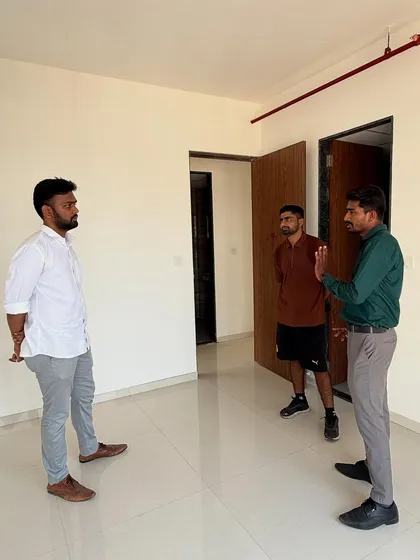 Discussing the layout and possibilities for a new apartment with the clients.