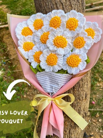 For the ultimate daisy lover, this full bouquet is packed with cheerful, handcrafted daisies and wrapped in pink paper for a soft, lovely look.