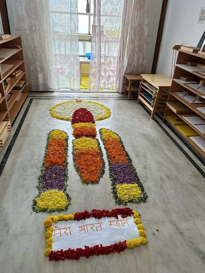 The vibrant colors of flower petals come together to form a rocket, a project that sparked so much curiosity and conversation among the children.